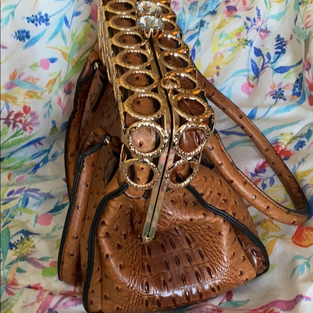 Brown alligator skinned w cage and jewel closure